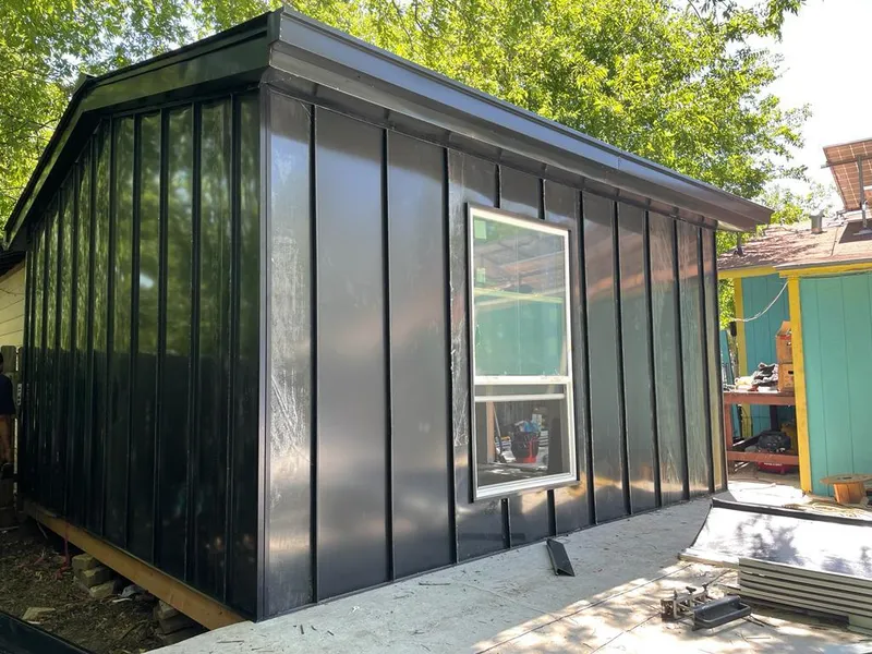 Black standing seam metal wall panels for Roof Inspection in Airway Heights