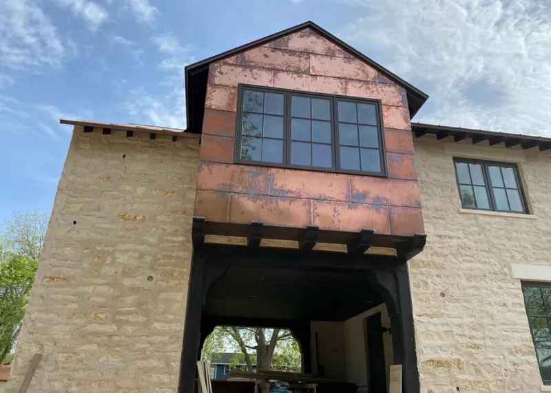 Copper metal panel facade on a stone building for Metal Roof Coating in Airway Heights