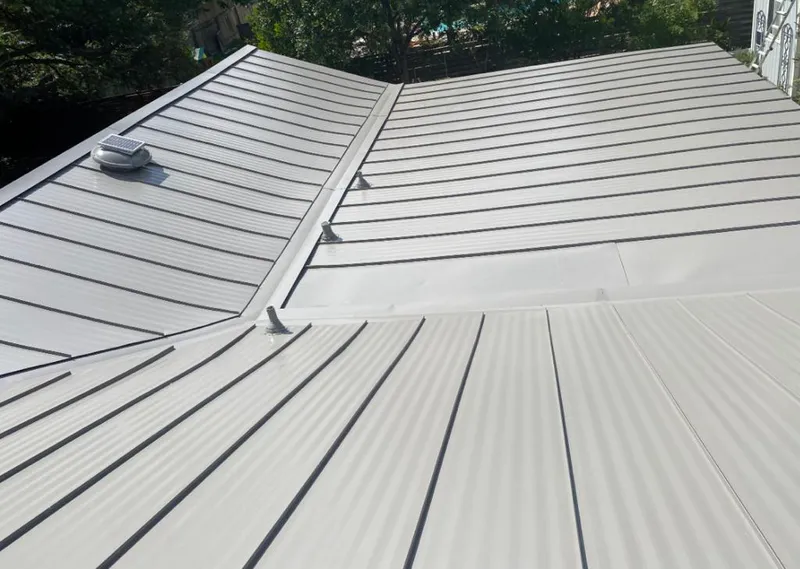 Solar attic fan installed on a metal roof for Roof Ventilation in Airway Heights
